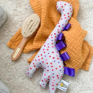 Rassel - Dino lila & gepunktet